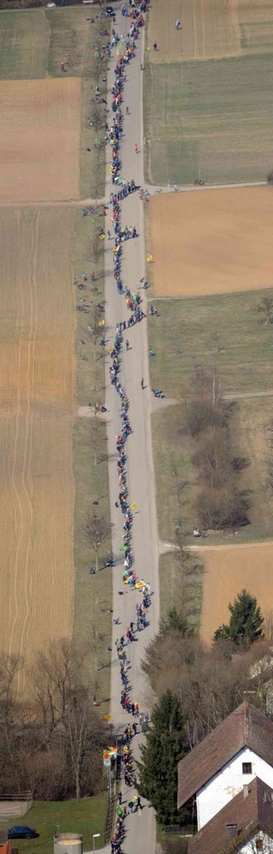 Anti-nuclear protesters form a human chain at the nuclear power plant at Neckarwestheim, southern Germany on March 12, 2011. Anti-nuclear protesters form a human chain at the nuclear power plant at Neckarwestheim, southern Germany on March 12, 2011.