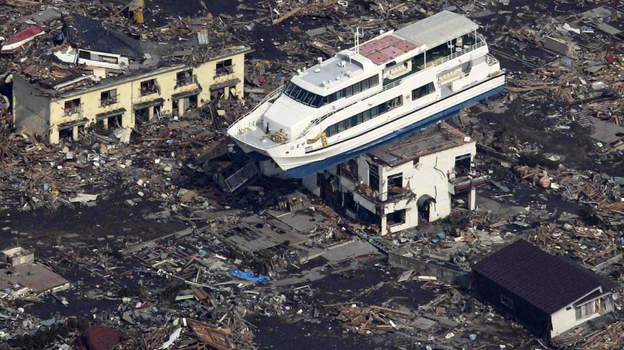 This aerial shot shows a pleasure boat sitting on top of a building amid a sea of debris in Otsuchi town in Iwate prefecture on March 14, following the March 11 tsunami.