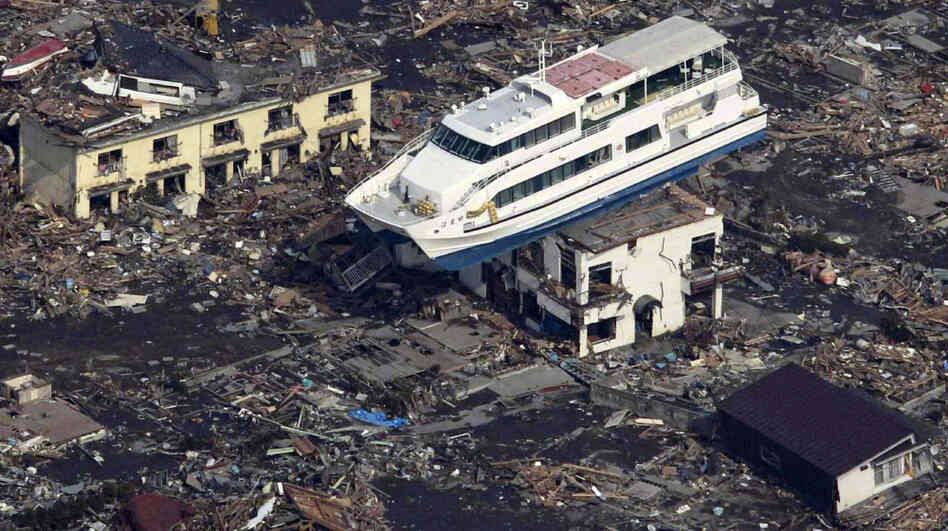 This aerial shot shows a pleasure boat sitting on top of a building amid a sea of debris in Otsuchi town in Iwate prefecture on March 14, following the March 11 tsunami.