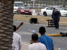 Riot police fire a tear gas canister at anti-government protesters Sunday, March 13, 2011, in Manama, Bahrain. Riot police fire a tear gas canister at anti-government protesters Sunday, March 13, 2011, in Manama, Bahrain.
