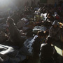 Japanese refugees rest inside a school gymnasium where hundreds took shelter in Sendai, northeastern Japan, Monday.