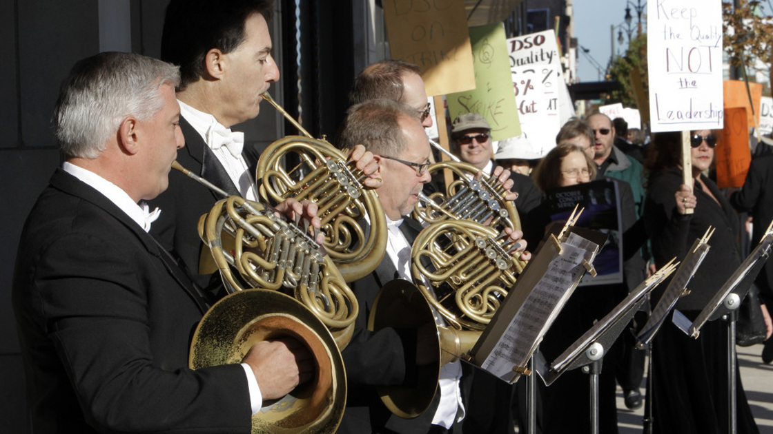 Members of the Detroit Symphony Orchestra play French horns while serenading their picketing colleagues outside the Max M. Fisher Music Center in Detroit, on Oct. 4, 2010. The musicians  called a strike after refusing to accept pay cuts of more than 30 percent demanded by the financially struggling Detroit Symphony Orchestra.