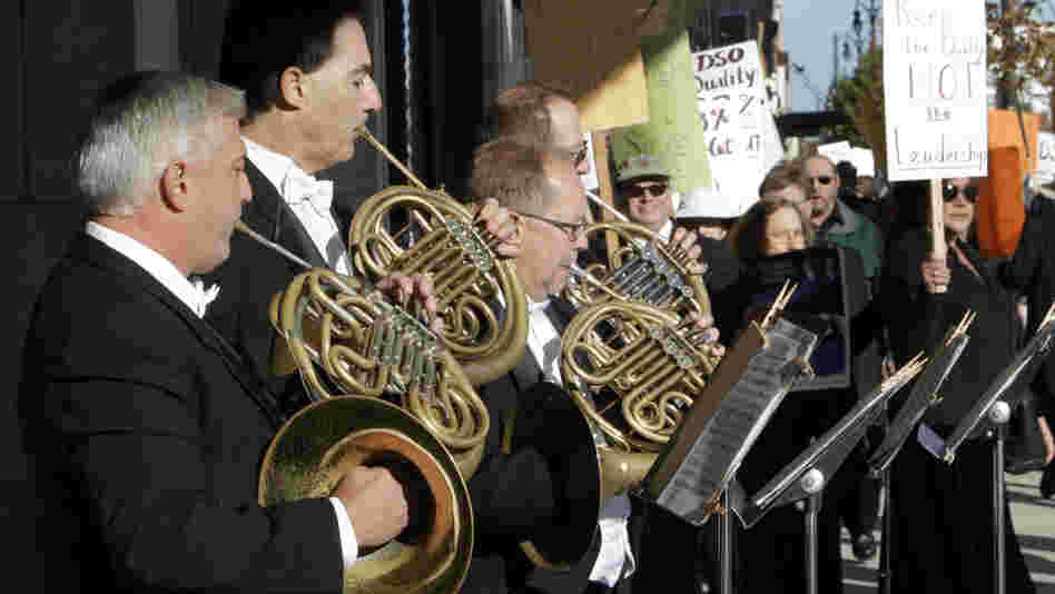 Members of the Detroit Symphony Orchestra play French horns while serenading their picketing colleagues outside the Max M. Fisher Music Center in Detroit, on Oct. 4, 2010. The musicians  called a strike after refusing to accept pay cuts of more than 30 percent demanded by the financially struggling Detroit Symphony Orchestra.