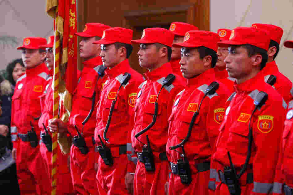Members of the Chinese rescue team prepare to depart to aid Japan at the airport in Beijing. 