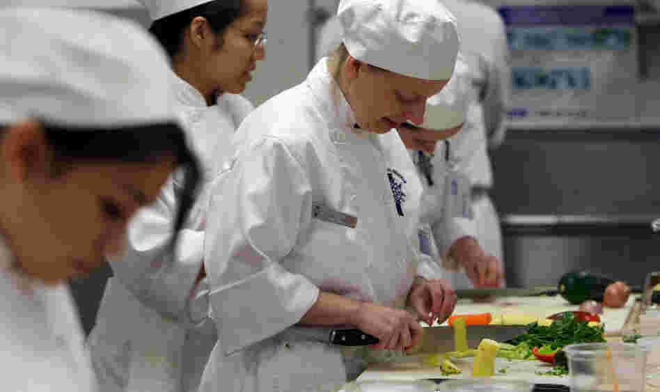 A culinary student cuts vegetables during a class at the Cordon Bleu program at the California Culinary Academy in San Francisco in 2009. Students are pouring into culinary schools to pursue their dreams. But once they graduate, many of them face a mountain of debt — and low starting salaries. A culinary student cuts vegetables during a class at the Cordon Bleu program at the California Culinary Academy in San Francisco in 2009. Students are pouring into culinary schools to pursue their dreams. But once they graduate, many of them face a mountain of debt — and low starting salaries.