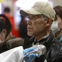 An evacuee is screened for radiation exposure at a testing center on Tuesday in Koriyama city, Fukushima prefecture. Officials are concerned about radiation leaking from the nuclear plant nearby. An evacuee is screened for radiation exposure at a testing center on Tuesday in Koriyama city, Fukushima prefecture. Officials are concerned about radiation leaking from the nuclear plant nearby.
