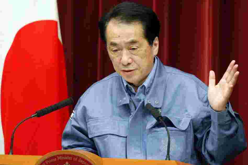 Japanese Prime Minister Naoto Kan told people living up to 12 miles outside an exclusion zone around a quake-hit nuclear plant to stay indoors, as a fire sent radiation to dangerous levels. 