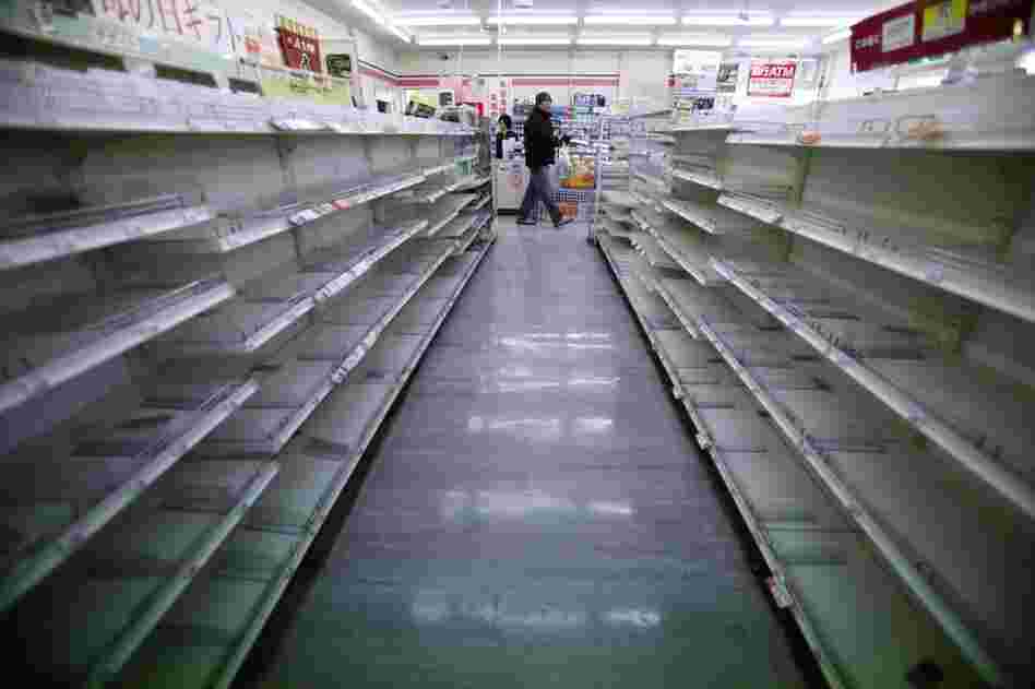 The shelves of a convenience store are empty in Ofunato, Iwate prefecture, northern Japan. 