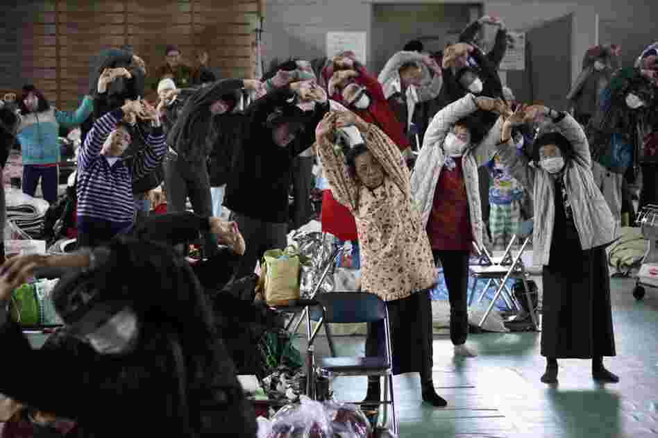 Evacuees exercise at a makeshift shelter in Minamisanriku, northern Japan. 