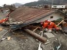 Search and rescue teams scour debris looking for survivors in Ofunato, Japan. Search and rescue teams scour debris looking for survivors in Ofunato, Japan.