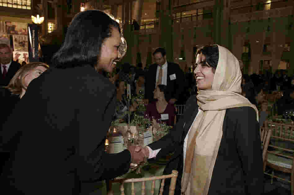 Kamila receiving congratulations from Condoleezza Rice. Courtesy US Global Leadership Campaign.