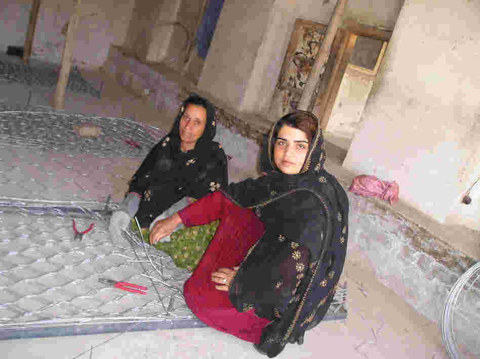 Kamila Sidiqi teaches gabion making while working with Mercy Corps. Courtesy of Mercy Corps.