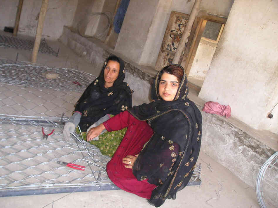 Kamila Sidiqi teaches gabion making while working with Mercy Corps. Courtesy of Mercy Corps.