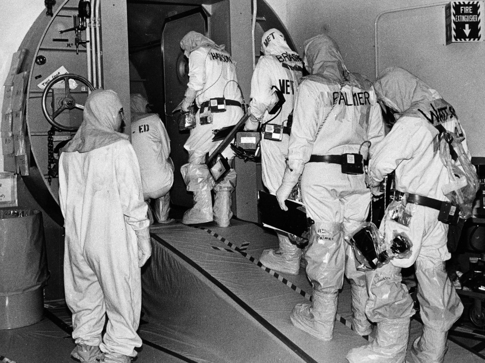 Technicians at the Three Mile Island plant enter the outer airlock door leading into the containment building housing of the disabled nuclear reactor in Harrisburg, Pa., on Feb. 11, 1982.