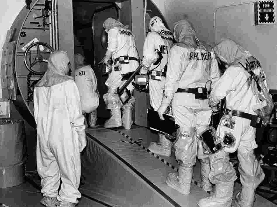 Technicians at the Three Mile Island plant enter the outer airlock door leading into the containment building housing of the disabled nuclear reactor in Harrisburg, Pa., on Feb. 11, 1982.