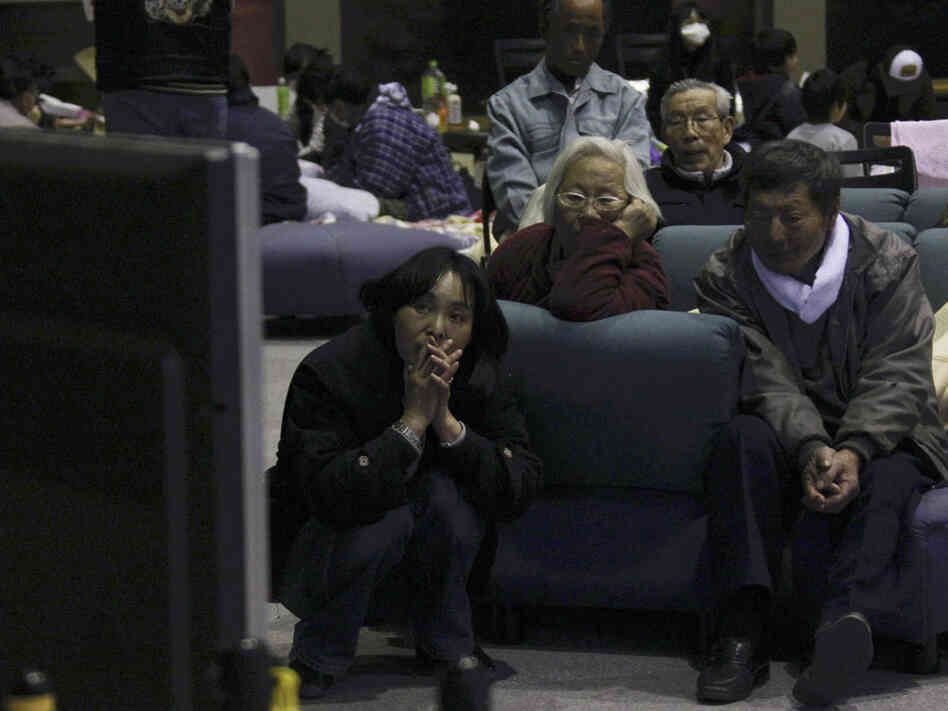 Evacuees watch television news on a troubled nuclear power plant at a makeshift shelter in Fukushima, northern Japan, Tuesday. (AP Photo/) Evacuees watch television news on a troubled nuclear power plant at a makeshift shelter in Fukushima, northern Japan, Tuesday. (AP Photo/)