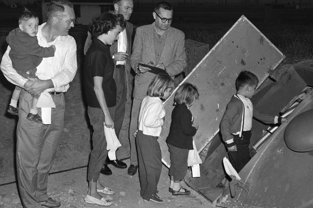The family of Navy Lt. Cmdr. Thomas W. Robinson prepares to enter an underground bomb shelter on Nov. 4, 1960, at Parks Air Force Base near Pleasanton, Calif., where they were to remain for 48 hours to test life in the shelter.