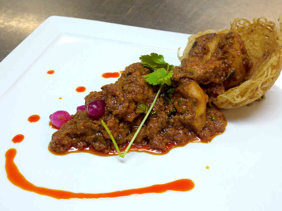 Murg Khatta Pyaz, or chicken morsels in onion-tomato gravy, is one of Oberoi's creations. "I have tried to incorporate timeless classics with modern cuisines," Oberoi writes.