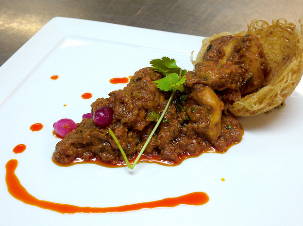 Murg Khatta Pyaz, or chicken morsels in onion-tomato gravy, is one of Oberoi's creations. "I have tried to incorporate timeless classics with modern cuisines," Oberoi writes.