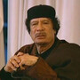 A jubilant Libyan leader Moammar Gadhafi appears Tuesday on state television. Gadhafi's forces have been pressing their advantage against rebels, with relentless shelling in the east and west.