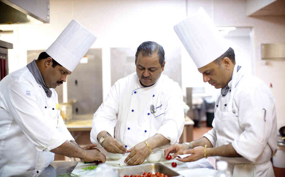 Oberoi (center) has worked for nearly 30 years at the Taj Mahal Palace and Towers, a luxury hotel in Mumbai. He was working at the hotel on Nov. 26, 2008 — the day terrorists attacked The Taj and several other sites in Mumbai. Gunmen roamed the halls of the hotel for hours, shooting anyone in sight.