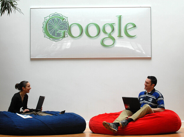 Employees at Google's Dublin office relax underneath the Irish-themed Google logo. Shifting most of its overseas profits through the Dublin office has saved Google billions in taxes.