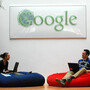 Employees at Google's Dublin office relax underneath the Irish-themed Google logo. Shifting most of its overseas profits through the Dublin office has saved Google billions in taxes.