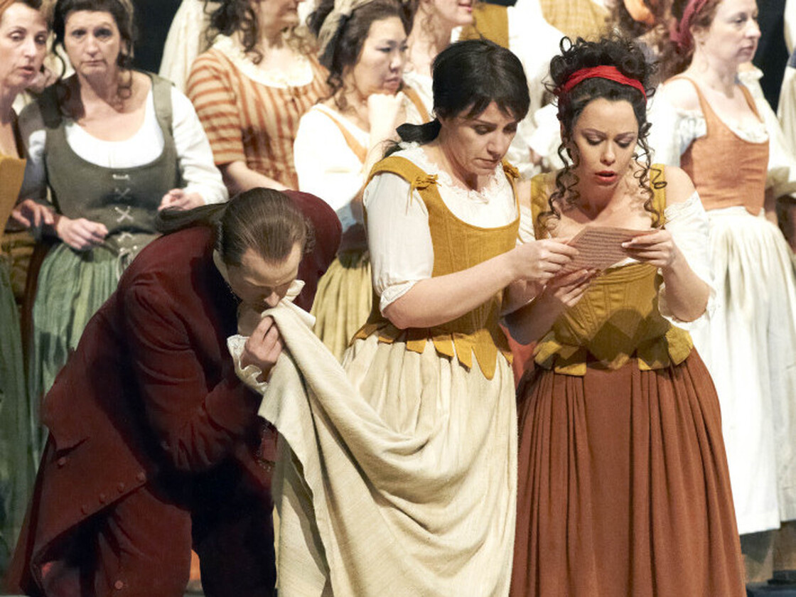 Cherubino (Anna Bonitatibus, center), dressed as Susanna, prepares to deceive the Count.