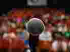 A microphone in front of an audience. A microphone in front of an audience.