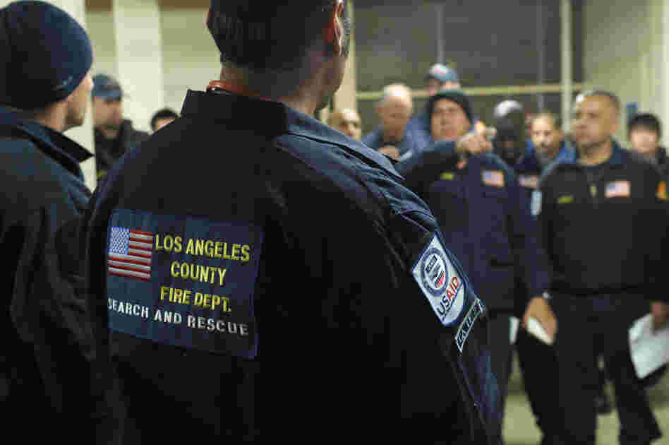 Members of search and rescue teams from Los Angeles County and Fairfax County, Va., get a briefing Monday before heading to Japan to help with rescue and recovery efforts. Members of search and rescue teams from Los Angeles County and Fairfax County, Va., get a briefing Monday before heading to Japan to help with rescue and recovery efforts.