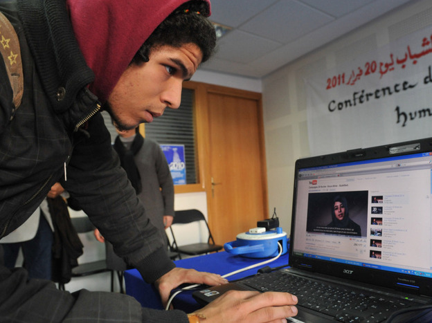 A young Moroccan watches a video on Feb. 17, calling for demonstrations. Three days later, the demonstration organized by a coalition of groups took place in cities throughout the country. U.S. intelligence officials say that in hindsight, using open sources like Facebook and Twitter could have helped them predict the uprisings that have swept the Arab world.