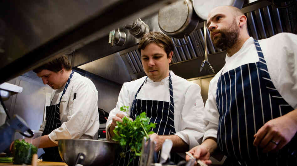 Todd Woods and his sous chefs prepare baby greens for a quick saute at Restaurant Nora in Washington, D.C. Todd Woods and his sous chefs prepare baby greens for a quick saute at Restaurant Nora in Washington, D.C.