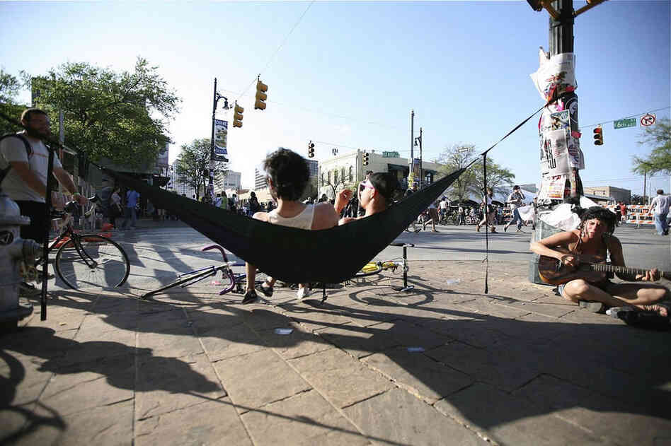 Some Austinites get crafty with a makeshift hammock. 
