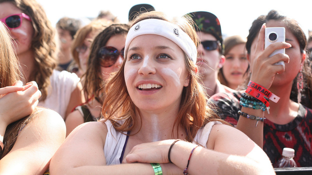 Claudia Garate of Austin, Texas, watches Man Man play at Auditorium Shores Saturday at SXSW.
