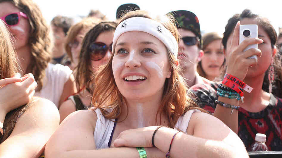 Claudia Garate of Austin, Texas, watches Man Man play at Auditorium Shores Saturday at SXSW.