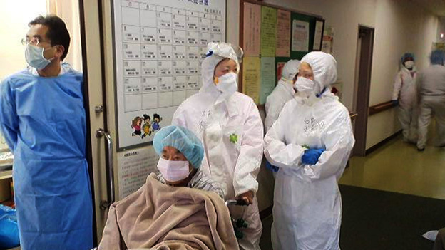 Nurses wear radiation protection suits at a hospital in Minamisoma city in Fukushima prefecture on March 16. Nurses wear radiation protection suits at a hospital in Minamisoma city in Fukushima prefecture on March 16.