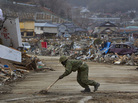The Japanese military works to clear roads in Ofunato, Japan on Sunday so that it can bring in more cranes and bulldozers to aid recovery operations. The Japanese military works to clear roads in Ofunato, Japan on Sunday so that it can bring in more cranes and bulldozers to aid recovery operations.