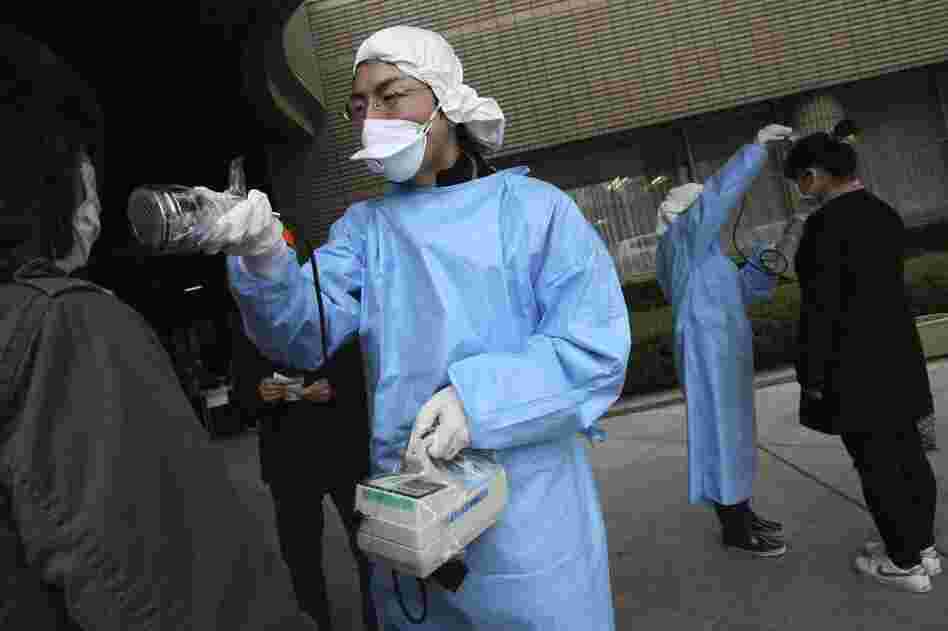 Women are screened for radiation exposure at an evacuation center in Fukushima, Fukushima prefecture. 