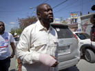 With a bandage in his right hand, Haitian-American singer Wyclef Jean, leaves a polling station after casting his ballot during a presidential runoff in Port-au-Prince, Haiti. With a bandage in his right hand, Haitian-American singer Wyclef Jean, leaves a polling station after casting his ballot during a presidential runoff in Port-au-Prince, Haiti.