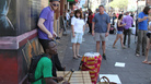 Percussionists Gidi Agbeko (green shirt) and Sam Bathrick (purple shirt) play on the street at SXSW in Austin on March 18, 2011. Percussionists Gidi Agbeko (green shirt) and Sam Bathrick (purple shirt) play on the street at SXSW in Austin on March 18, 2011.