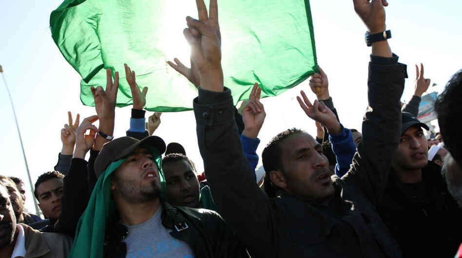 Men in Tripoli join in the part-protest, part-funeral for civilians said to have died during recent airstrikes in Libya. They gathered at a place along Libya's Mediterranean coast known as a cemetery for martyrs. Men in Tripoli join in the part-protest, part-funeral for civilians said to have died during recent airstrikes in Libya. They gathered at a place along Libya's Mediterranean coast known as a cemetery for martyrs.