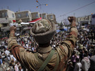 In Sanaa today, a Yemeni army officer reacts after he and other officers joined anti-government protesters demanding the resignation of President Ali Abdullah Saleh. In Sanaa today, a Yemeni army officer reacts after he and other officers joined anti-government protesters demanding the resignation of President Ali Abdullah Saleh.