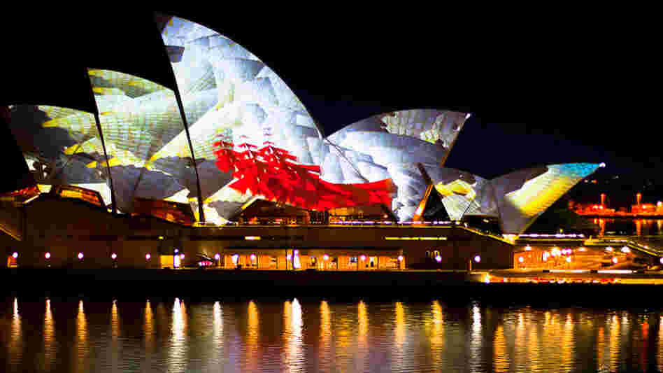 Projections on the giant sails of the Sydney Opera House, which served as the venue for the YouTube Symphony Orchestra concert. Projections on the giant sails of the Sydney Opera House, which served as the venue for the YouTube Symphony Orchestra concert.