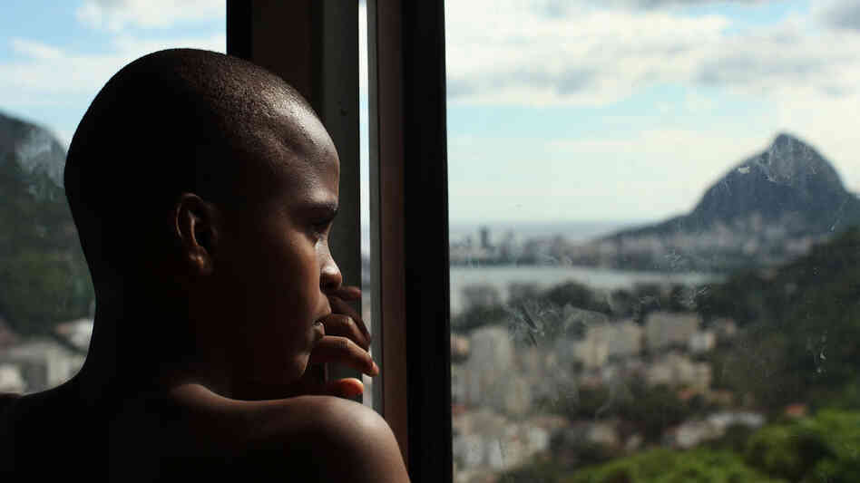 Devanil De Souza Jr. looks out over the recently pacified Santa Marta, one of Rio's oldest favelas. Arrival City points to Santa Marta as a migrant community that has been integrated into the larger city (and economy), as the state recently gave its residents the same benefits (street names, birth certificates, soccer fields, WiFi, garbage collection, etc.) that wealthier residents enjoy. Devanil De Souza Jr. looks out over the recently pacified Santa Marta, one of Rio's oldest favelas. Arrival City points to Santa Marta as a migrant community that has been integrated into the larger city (and economy), as the state recently gave its residents the same benefits (street names, birth certificates, soccer fields, WiFi, garbage collection, etc.) that wealthier residents enjoy.
