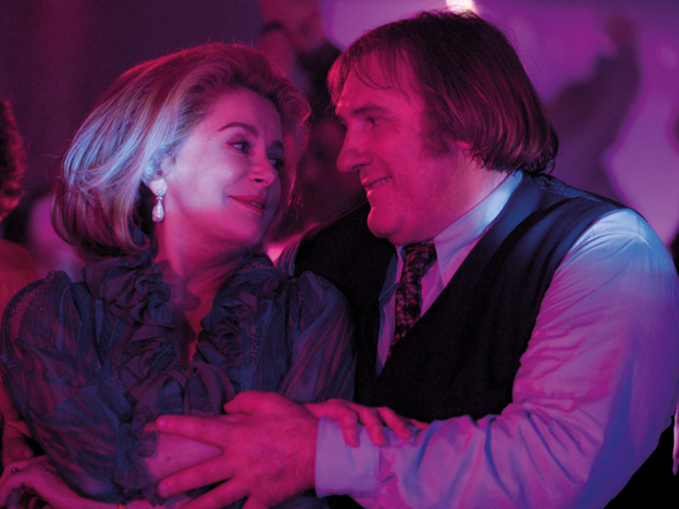 Bright Side: With a union leader (Gerard  Depardieu, right) who's also an old flame, Deneuve's Suzanne sets out to settle  a labor dispute that has proved too much for her dismissive husband.