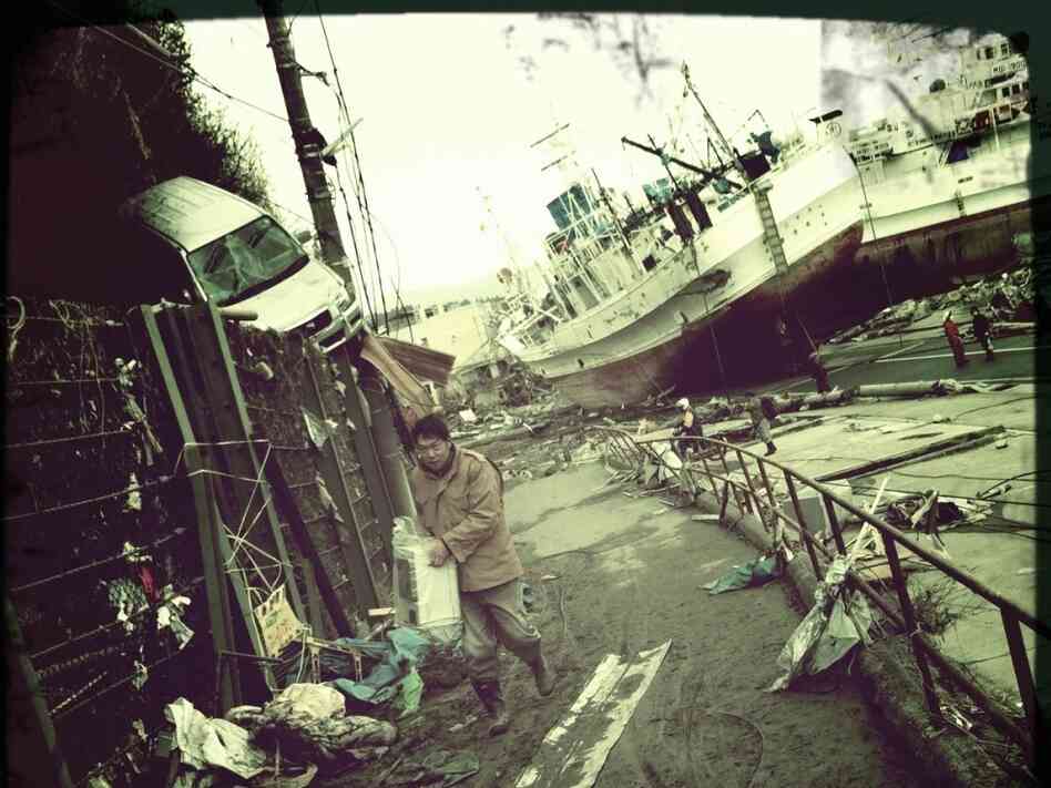 A man walks up from the port of Kesennuma, Japan.