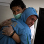 A Libyan man grieved Tuesday in the morgue of the Jalaa hospital in Benghazi after identifying his brother, who died in fighting around the city of Ajdabiya.