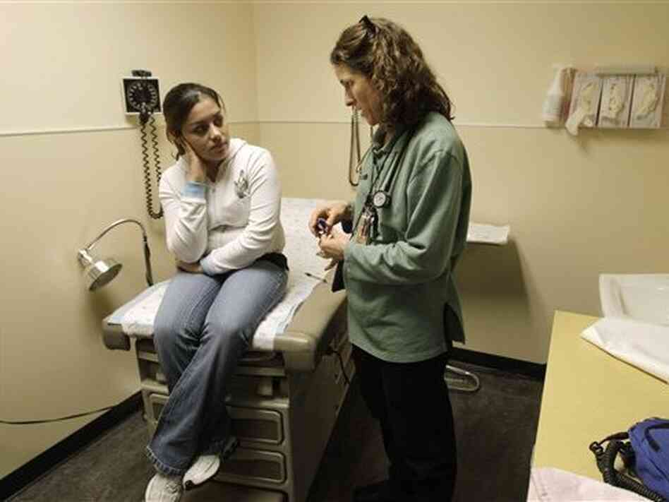 Dr. Sarah Hufbauer, a family practice doctor at a Seattle clinic, with a patient, Feb. 4, 2011. Dr. Sarah Hufbauer, a family practice doctor at a Seattle clinic, with a patient, Feb. 4, 2011.
