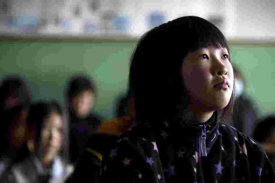 Japanese students attend an emotional graduation ceremony at the Ohya elementary school in Kesennuma. 