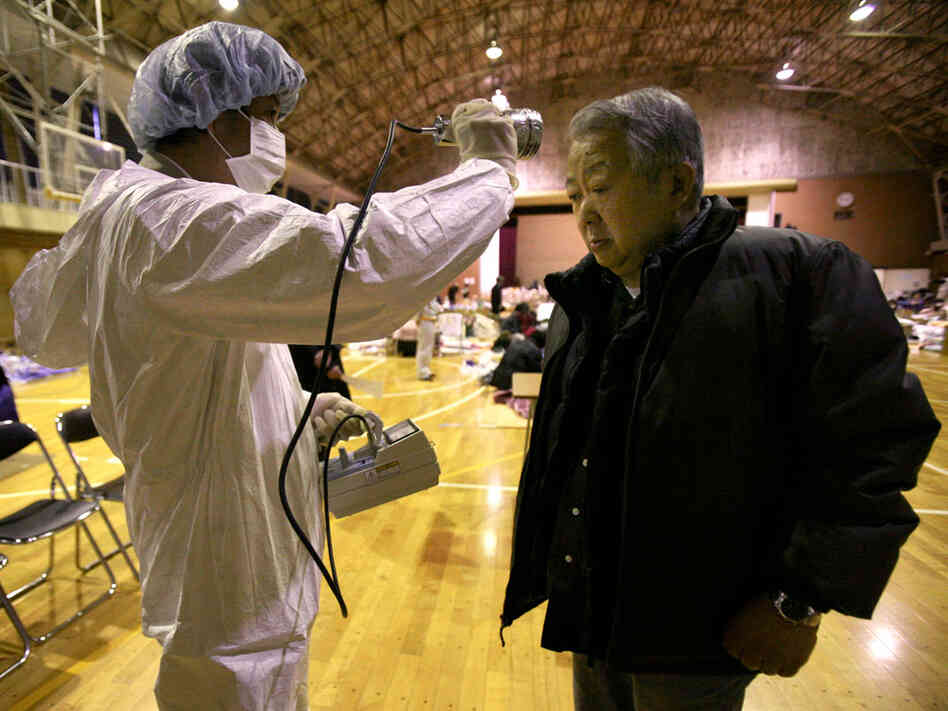 A man is screened for radiation exposure March 16 at a shelter in Fukushima city after being evacuated from an area near the nuclear facilities damaged by Japan's earthquake and tsunami. A man is screened for radiation exposure March 16 at a shelter in Fukushima city after being evacuated from an area near the nuclear facilities damaged by Japan's earthquake and tsunami.